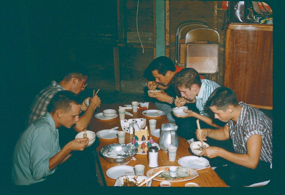 eating with chopsticks -location unknown